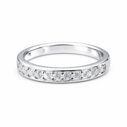 Round Moissanite Diamond Full Eternity Stackable Ring 1 Carat with a sleek silver band adorned with sparkling round moissanite diamonds set continuously around the ring.