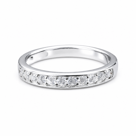 Round Moissanite Diamond Full Eternity Stackable Ring 1 Carat with a sleek silver band adorned with sparkling round moissanite diamonds set continuously around the ring.