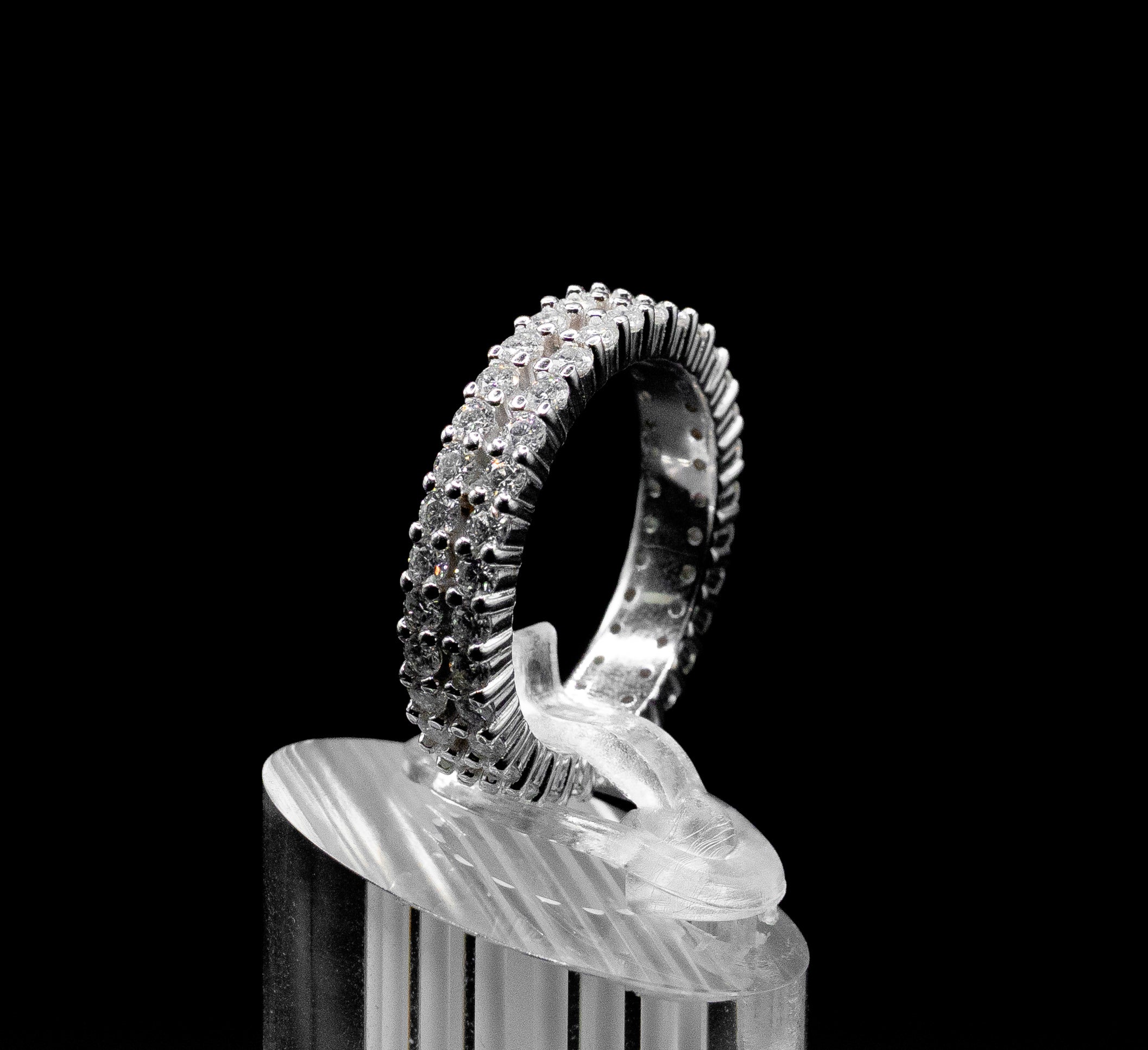 Elegant Moissanite Diamond Full Eternity Band Ring – 1.80ct Double Row displayed on a clear stand, showcasing its sparkling double row of stones against a black background.