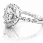 Pear Cut Moissanite Halo Engagement Ring 2CT | GRA Certified featuring a pear-shaped center stone surrounded by a sparkling halo and set on a diamond-accented band.