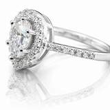 Pear Cut Moissanite Halo Engagement Ring 2CT | GRA Certified featuring a pear-shaped center stone surrounded by a sparkling halo and set on a diamond-accented band.