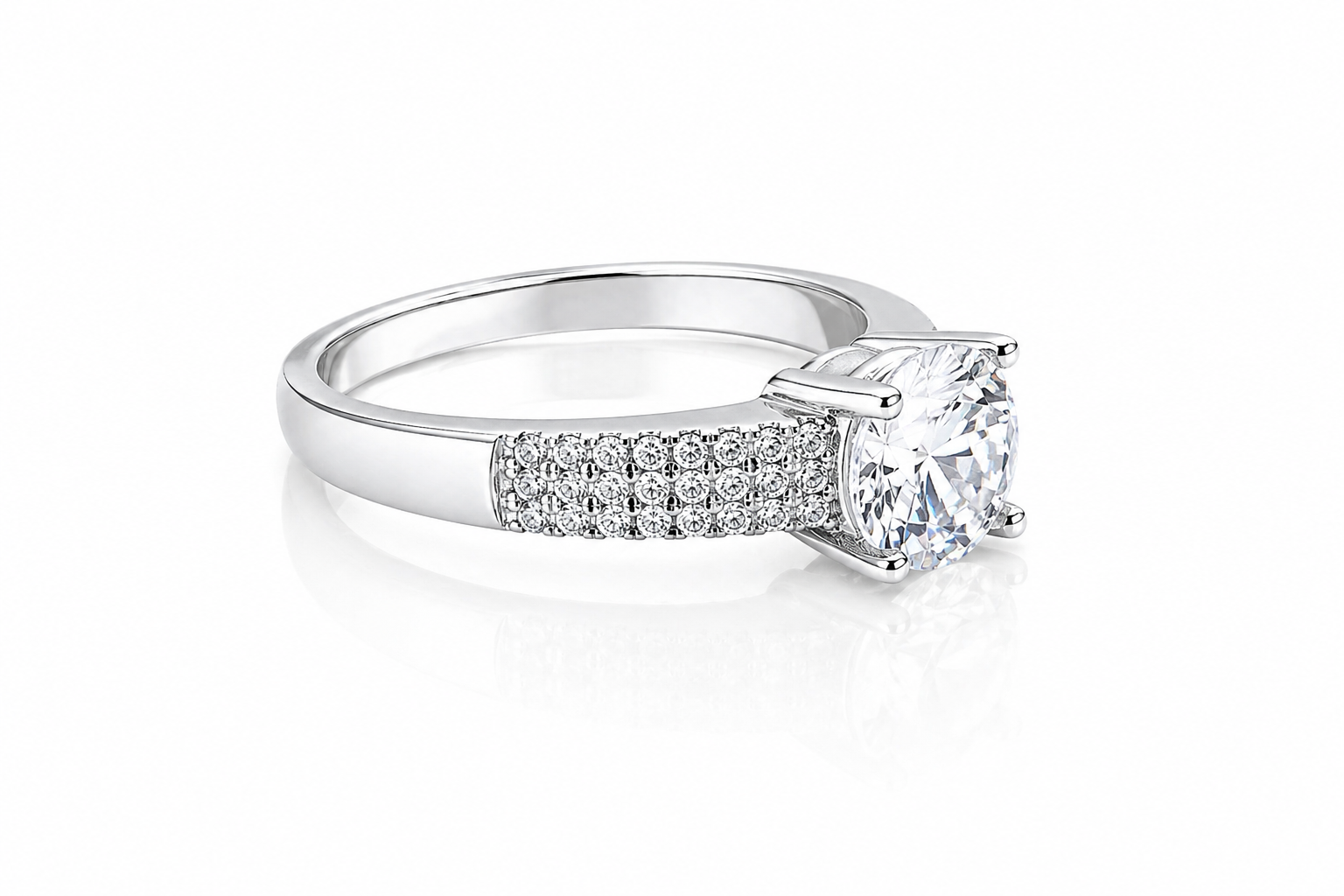 Close-up of a Round Moissanite Solitaire Ring with Accents 1.28CT | GRA Certified, featuring a sparkling round center stone and pavé-set accent stones on a polished band.