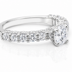 Round Moissanite Pave Engagement Ring 2.5CT | GRA Certified featuring a sparkling round center stone with pave-set smaller stones along a polished band.