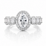 Oval Moissanite Halo Wedding Ring 2.3CT | GRA Certified featuring a sparkling oval center stone surrounded by a halo of smaller stones with additional accents on the band.