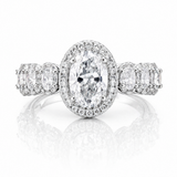 Oval Moissanite Halo Wedding Ring 2.3CT | GRA Certified featuring a sparkling oval center stone surrounded by a halo of smaller stones with additional accents on the band.