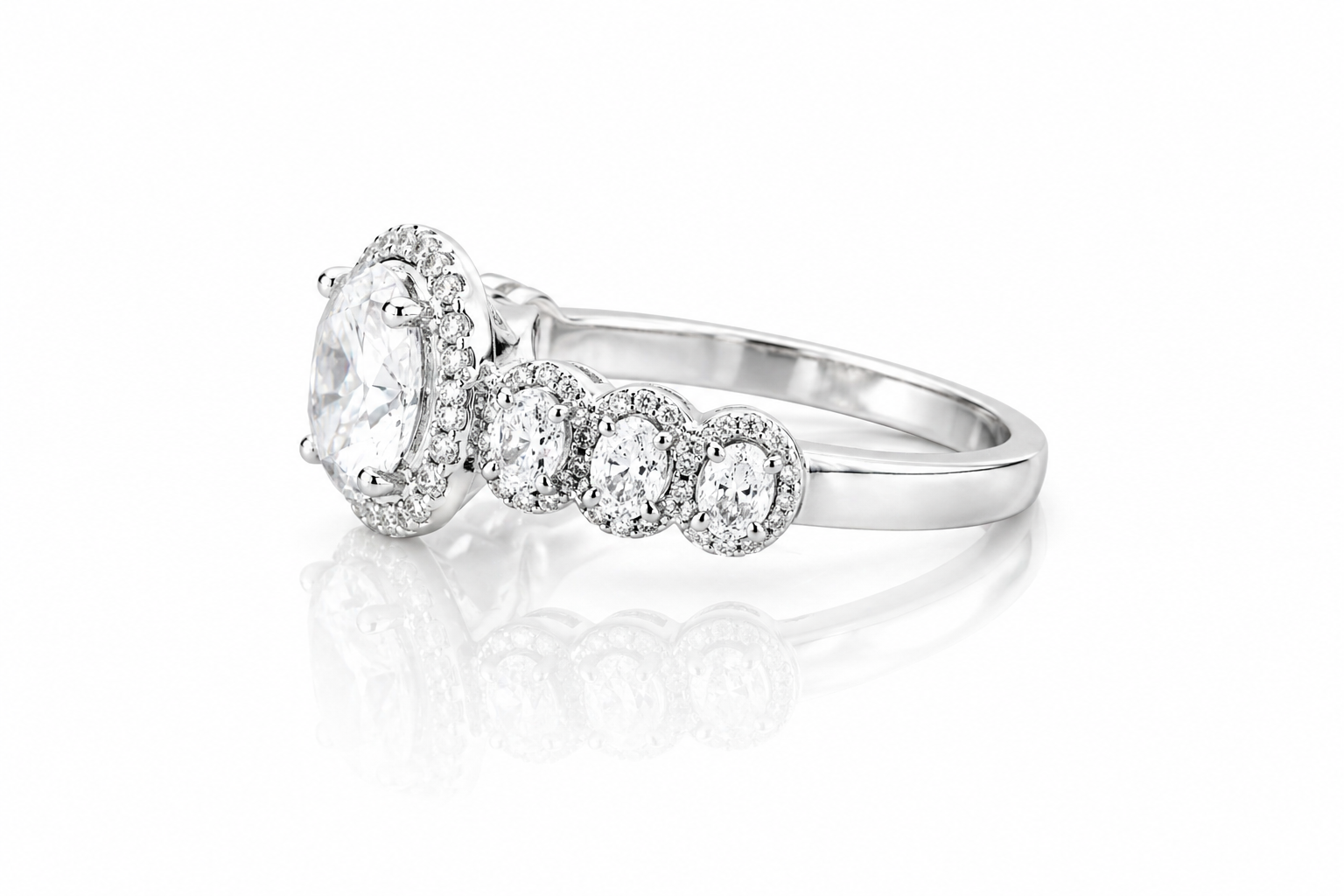 Oval Moissanite Halo Wedding Ring 2.3CT | GRA Certified featuring a sparkling oval center stone surrounded by a halo of smaller stones and additional round accents on a polished band.