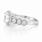 Oval Moissanite Halo Wedding Ring 2.3CT | GRA Certified featuring a sparkling oval center stone surrounded by a halo of smaller stones and additional round accents on a polished band.