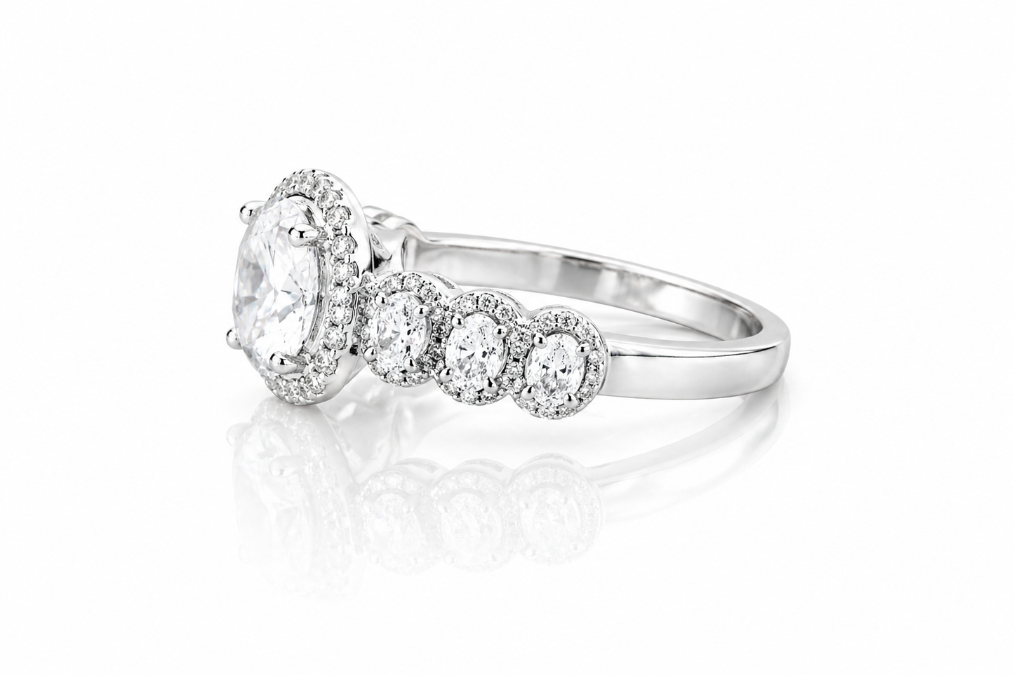 Oval Moissanite Halo Wedding Ring 2.3CT | GRA Certified featuring a sparkling oval center stone surrounded by a halo of smaller stones and additional round accents on a polished band.