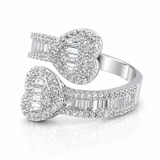 Moissanite Baguette Open Heart Ring | GRA Certified Diamond Approved featuring two open heart shapes adorned with baguette and round cut stones on a polished band.