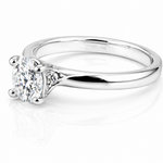 Oval Moissanite Solitaire Engagement Ring 1CT | GRA Certified featuring a sparkling oval moissanite set in a sleek, polished silver band, ideal for an elegant engagement gift.