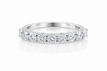 U-Prong Moissanite Half Eternity Wedding Band – 1CT VVS1 D Color | 925 Sterling Silver | GRA Certified, featuring sparkling round moissanite stones set in a polished silver band.