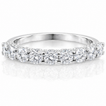 U-Prong Moissanite Half Eternity Wedding Band – 1CT VVS1 D Color | 925 Sterling Silver | GRA Certified, featuring sparkling round moissanite stones set in a polished silver band.
