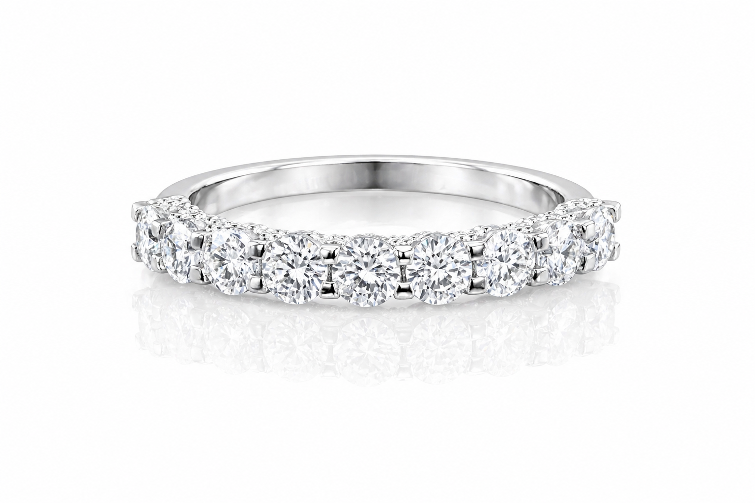 U-Prong Moissanite Half Eternity Wedding Band – 1CT VVS1 D Color | 925 Sterling Silver | GRA Certified, featuring sparkling round moissanite stones set in a polished silver band.
