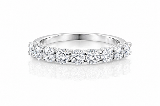 U-Prong Moissanite Half Eternity Wedding Band – 1CT VVS1 D Color | 925 Sterling Silver | GRA Certified, featuring sparkling round moissanite stones set in a polished silver band.
