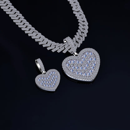 Silver heart-shaped pendant and necklace on a black background