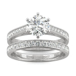 Close-up of a sparkling Moissanite Micro Pavé Bridal Ring Set 2.5CT | GRA Certified featuring a large round center stone with smaller pavé stones along the bands in polished metal.