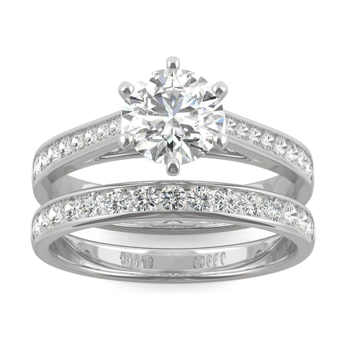 Close-up of a sparkling Moissanite Micro Pavé Bridal Ring Set 2.5CT | GRA Certified featuring a large round center stone with smaller pavé stones along the bands in polished metal.