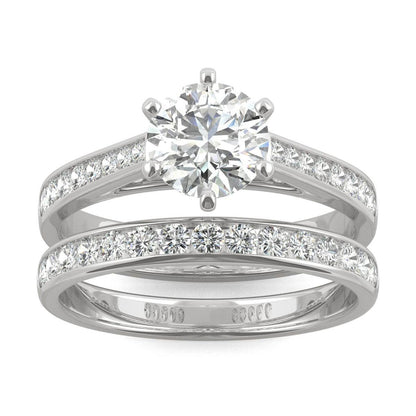 Close-up of a sparkling Moissanite Micro Pavé Bridal Ring Set 2.5CT | GRA Certified featuring a large round center stone with smaller pavé stones along the bands in polished metal.