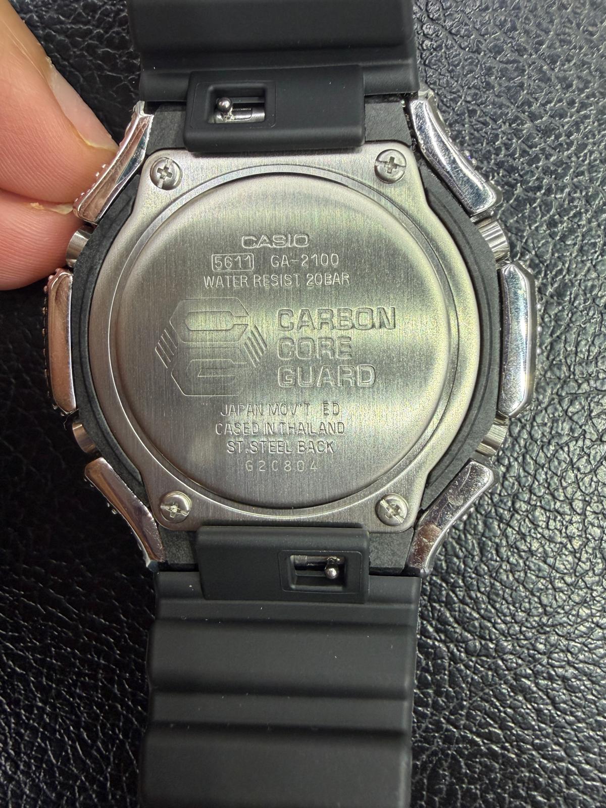 Casio watch back view with 'Carbon Core Guard' text on a black textured background
